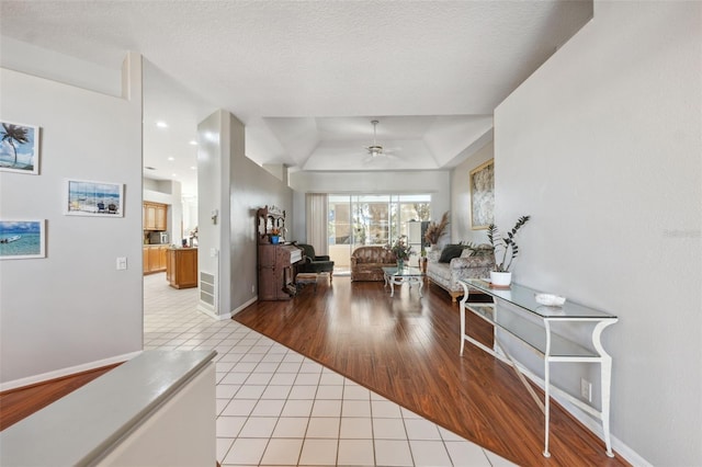 interior space featuring a textured ceiling and light tile patterned floors