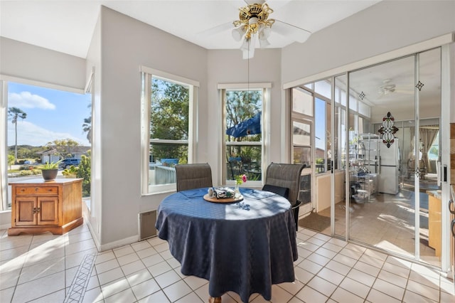 dining room featuring light tile patterned floors and ceiling fan