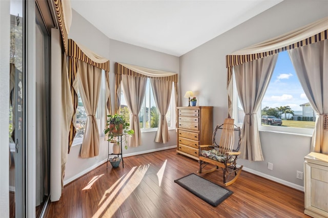 living area with hardwood / wood-style flooring