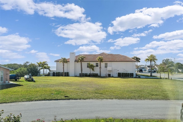 view of property exterior with a lawn