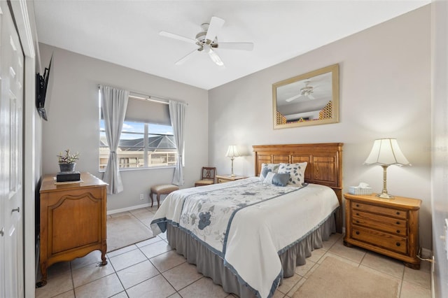 bedroom featuring light tile patterned flooring and ceiling fan