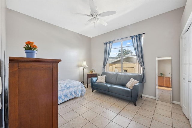 tiled bedroom featuring ceiling fan