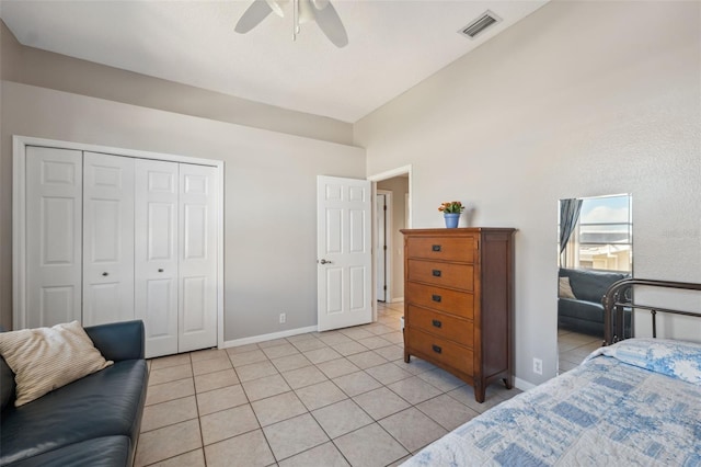 tiled bedroom with a closet and ceiling fan