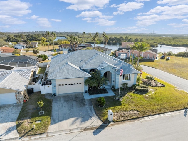 birds eye view of property with a water view