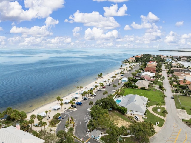 birds eye view of property featuring a water view and a view of the beach