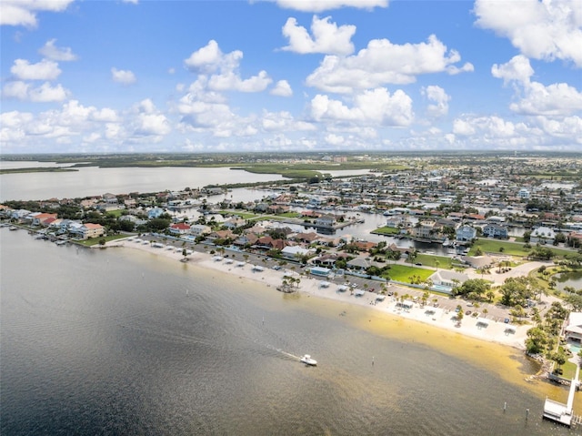 bird's eye view featuring a water view and a view of the beach