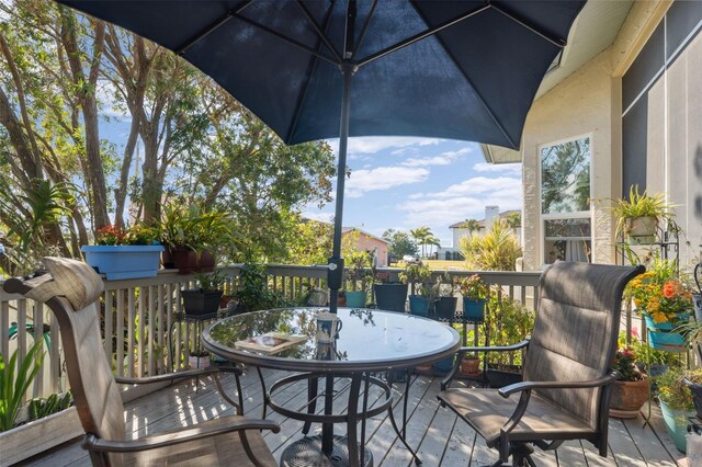3912 Rudder Way, New Port Richey, FL 34652 - wooden deck with outdoor dining space