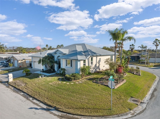 3912 Rudder Way, New Port Richey, FL 34652 - view of front of property with concrete driveway, an attached garage, a front lawn, and stucco siding