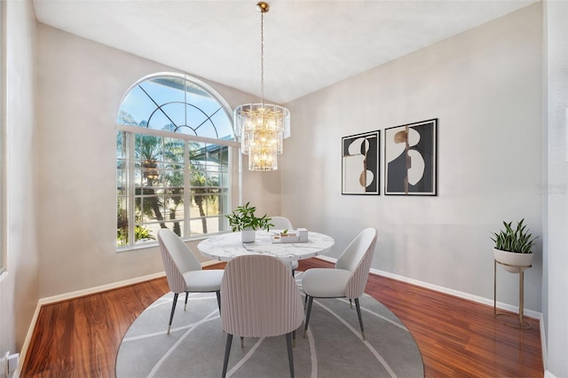 3912 Rudder Way, New Port Richey, FL 34652 - dining room featuring plenty of natural light, wood finished floors, and a chandelier