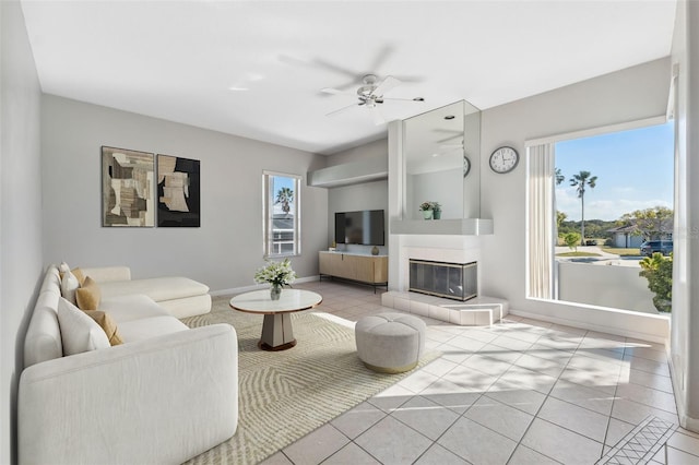 3912 Rudder Way, New Port Richey, FL 34652 - tiled living room with plenty of natural light, ceiling fan, and a tiled fireplace