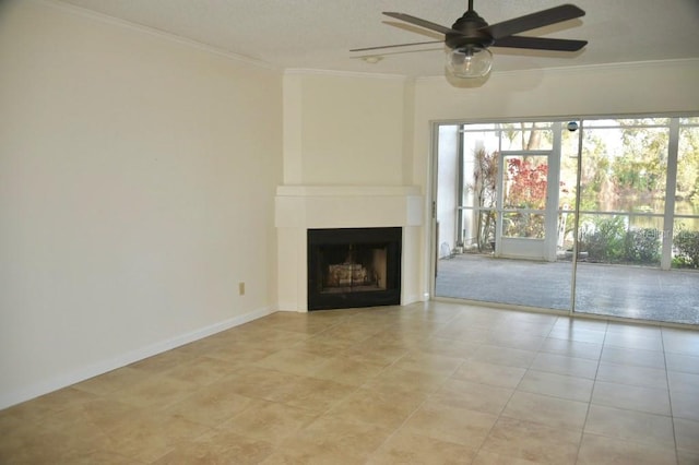 unfurnished living room with crown molding, a large fireplace, light tile patterned floors, and ceiling fan