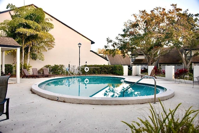 view of swimming pool with a patio area