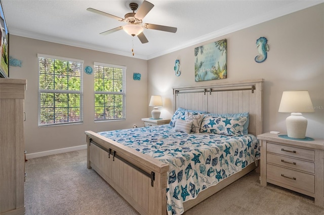 bedroom with crown molding, light colored carpet, and ceiling fan