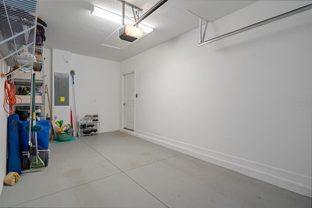 garage with a garage door opener and electric panel