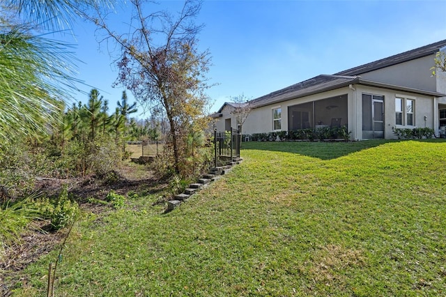 view of yard featuring a sunroom