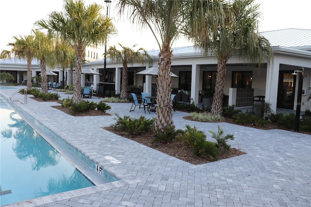 rear view of property featuring a patio area