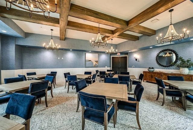 dining space with beamed ceiling, coffered ceiling, and a notable chandelier