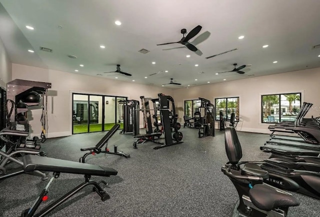 exercise room with ceiling fan