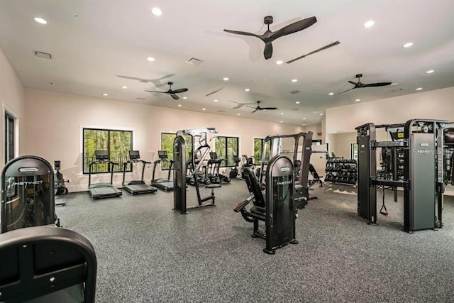 gym with ceiling fan and a wealth of natural light