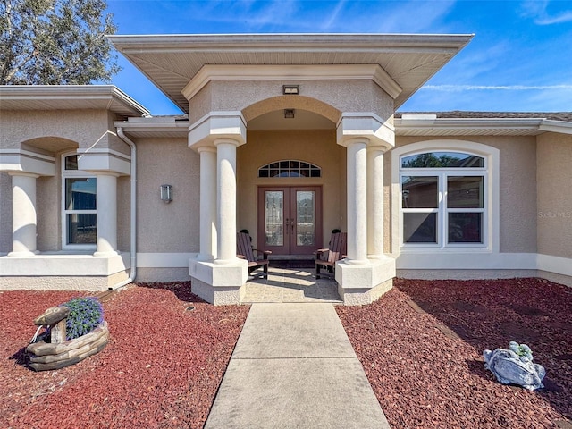 view of exterior entry featuring french doors