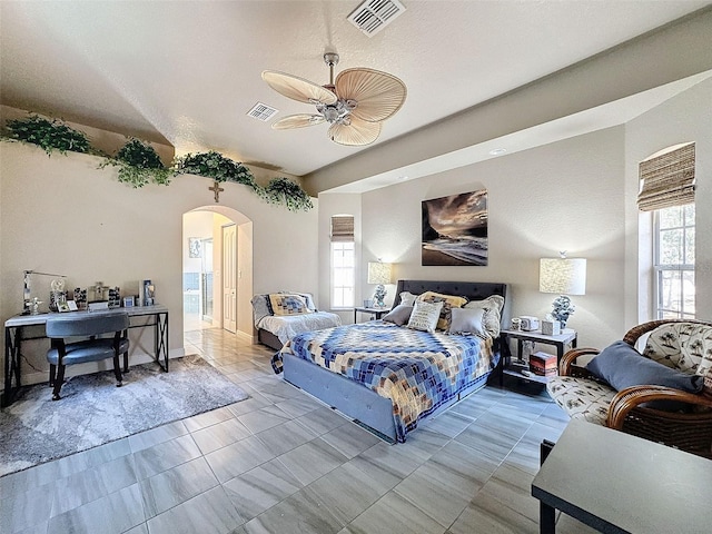 tiled bedroom with ceiling fan