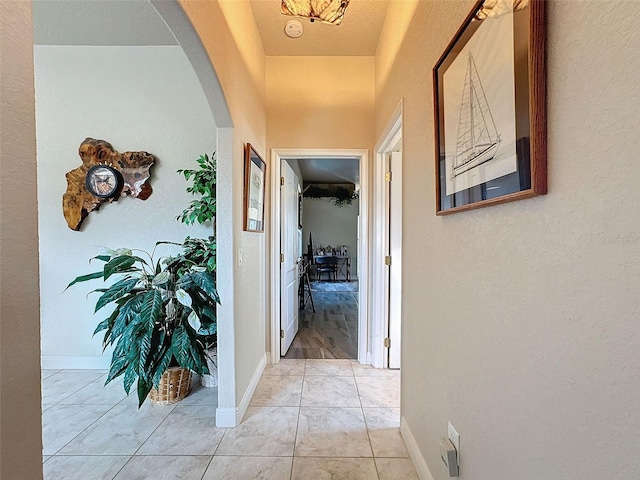 hallway featuring light tile patterned flooring