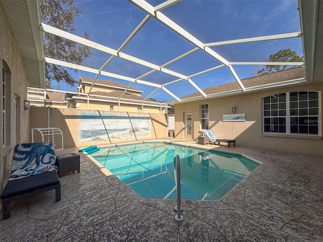 view of pool with a lanai and a patio area