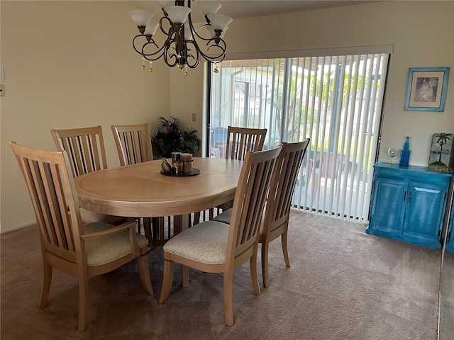 carpeted dining area featuring a notable chandelier