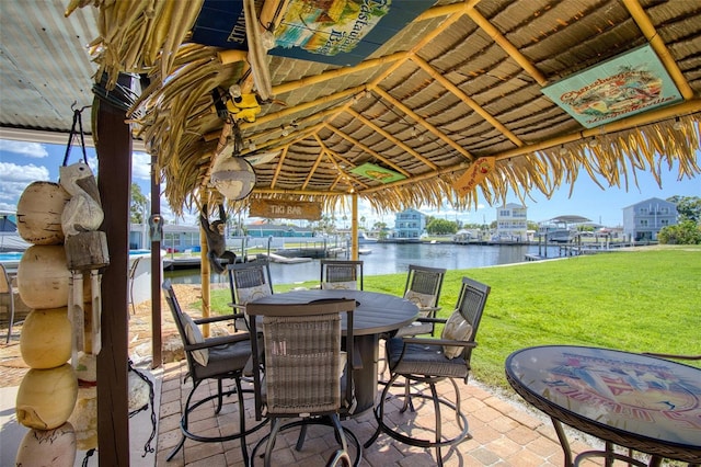 view of patio featuring a gazebo and a water view