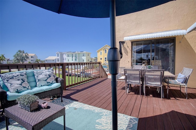 deck with an outdoor hangout area and outdoor dining space