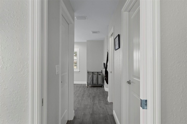 hallway featuring dark wood-type flooring