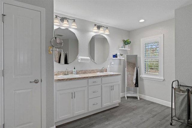 bathroom with vanity and hardwood / wood-style floors