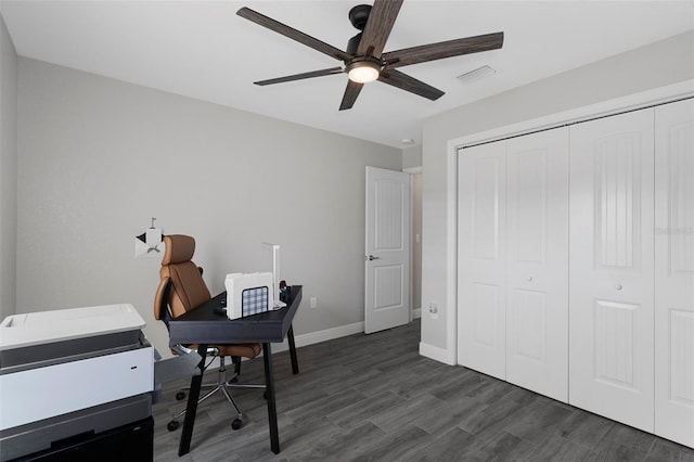 office with dark wood-type flooring and ceiling fan