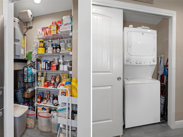 washroom with stacked washer and dryer