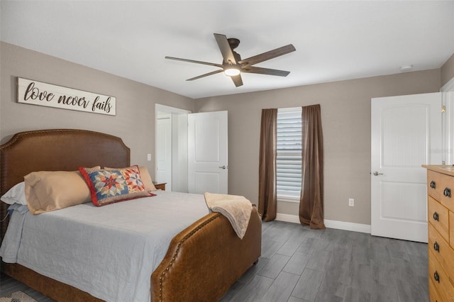 bedroom featuring dark hardwood / wood-style floors and ceiling fan