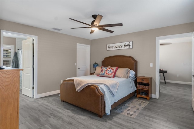 bedroom with hardwood / wood-style flooring and ceiling fan