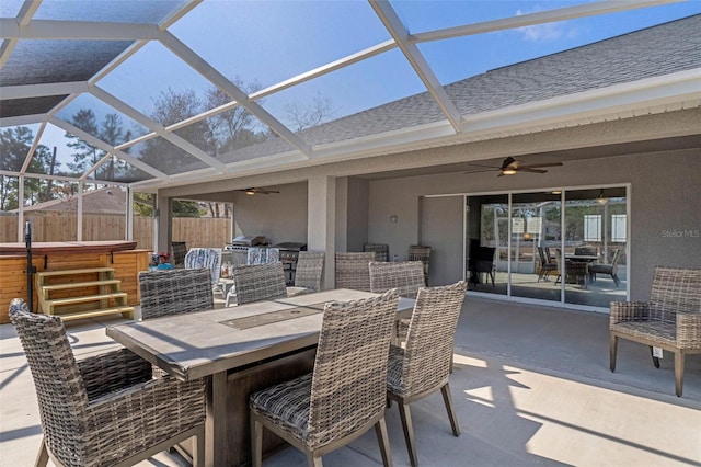 view of patio / terrace featuring a hot tub and ceiling fan