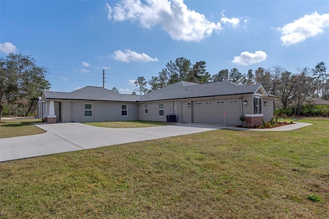 single story home featuring cooling unit, a garage, and a front lawn