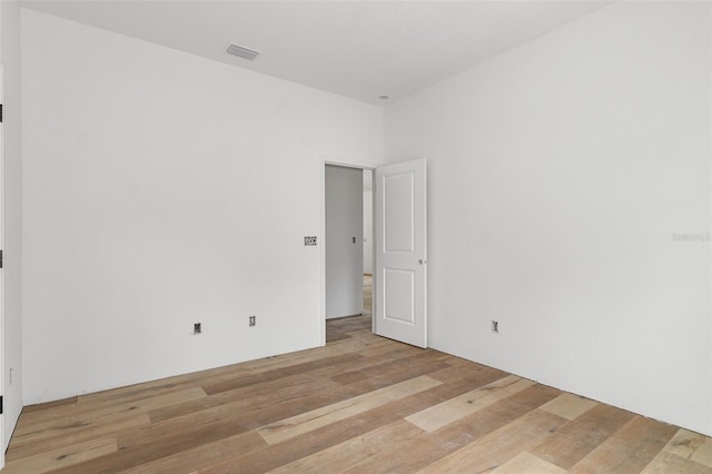 empty room with light wood-type flooring