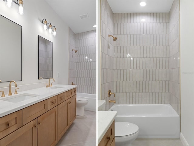 full bathroom with vanity, tiled shower / bath combo, and toilet