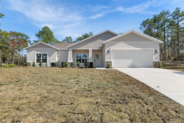 single story home featuring stucco siding, a front lawn, concrete driveway, and a garage