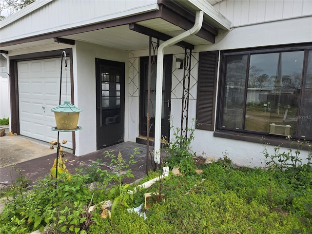 entrance to property featuring a garage