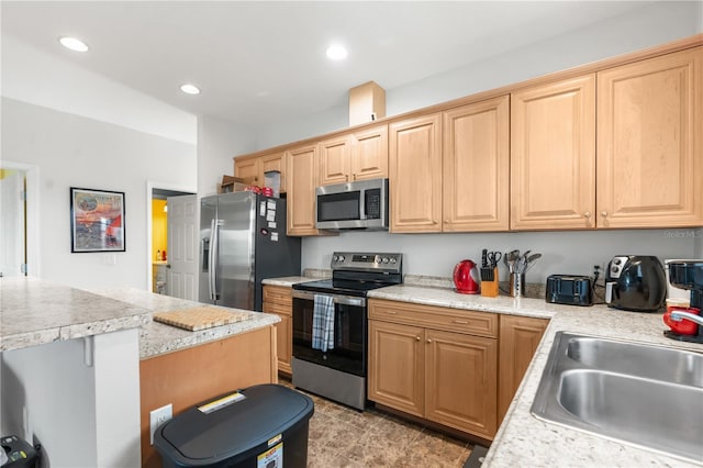 kitchen with appliances with stainless steel finishes and sink