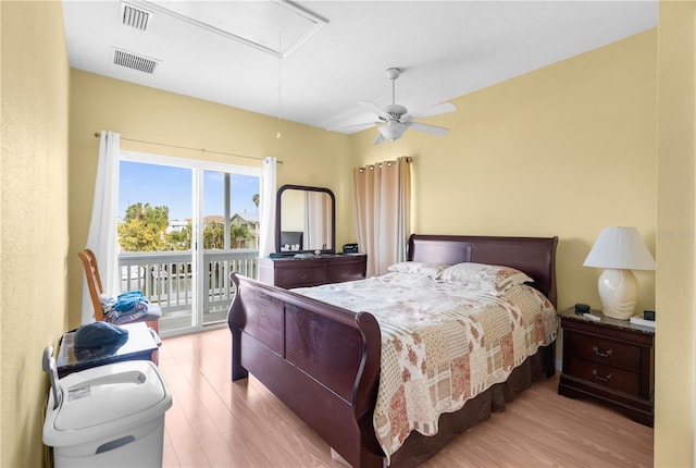 bedroom featuring ceiling fan, light hardwood / wood-style flooring, and access to outside