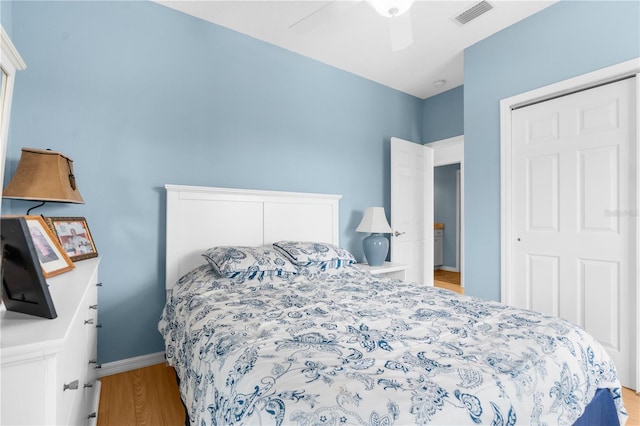 bedroom with ceiling fan and light hardwood / wood-style floors