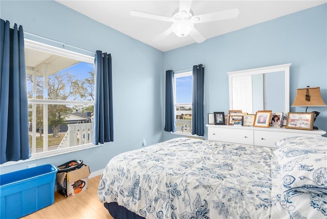 bedroom featuring hardwood / wood-style floors and ceiling fan