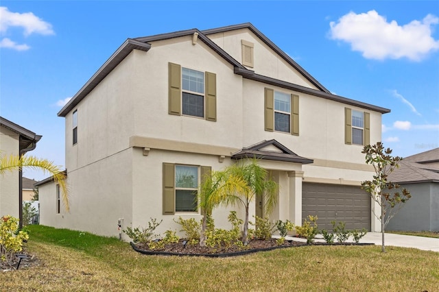 view of front property with a garage and a front yard