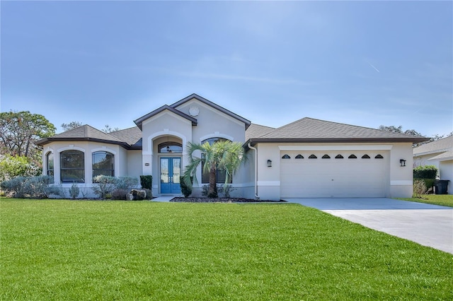 single story home with french doors, a garage, and a front lawn