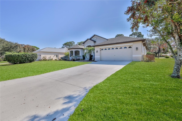 view of front of home with a garage and a front lawn