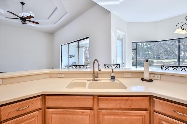 kitchen with ceiling fan and sink